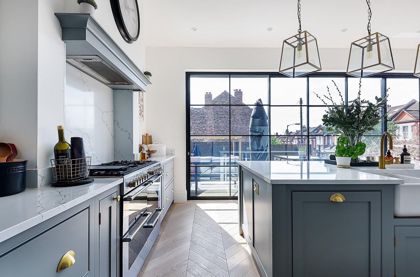 Contemporary hand-painted kitchen with stone worktops and expert finish work
